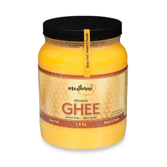Jar of Modhani Desi Ghee made from clarified butter, featuring traditional packaging ideal for Indian cooking, baking, frying, and enhancing flavor in meals.
