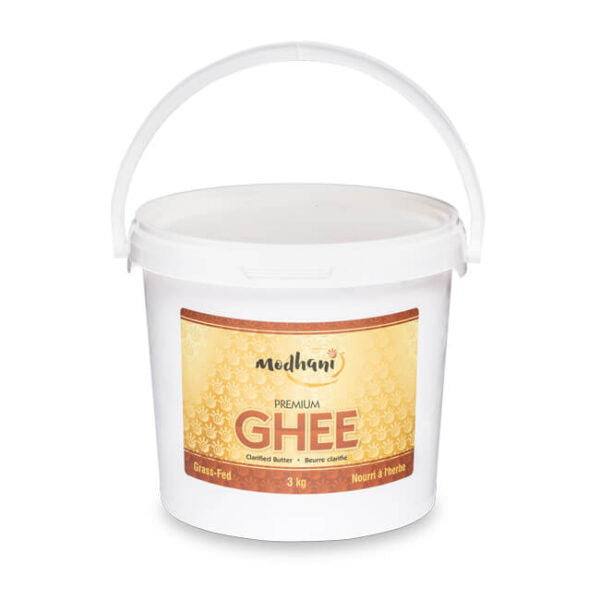 Jar of Modhani Desi Ghee made from clarified butter, featuring traditional packaging ideal for Indian cooking, baking, frying, and enhancing flavor in meals.
