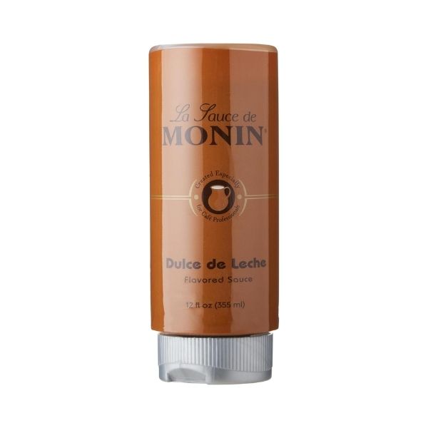 Close up of the label for Monin Dulce de Leche sauce showing cafe professional branding.